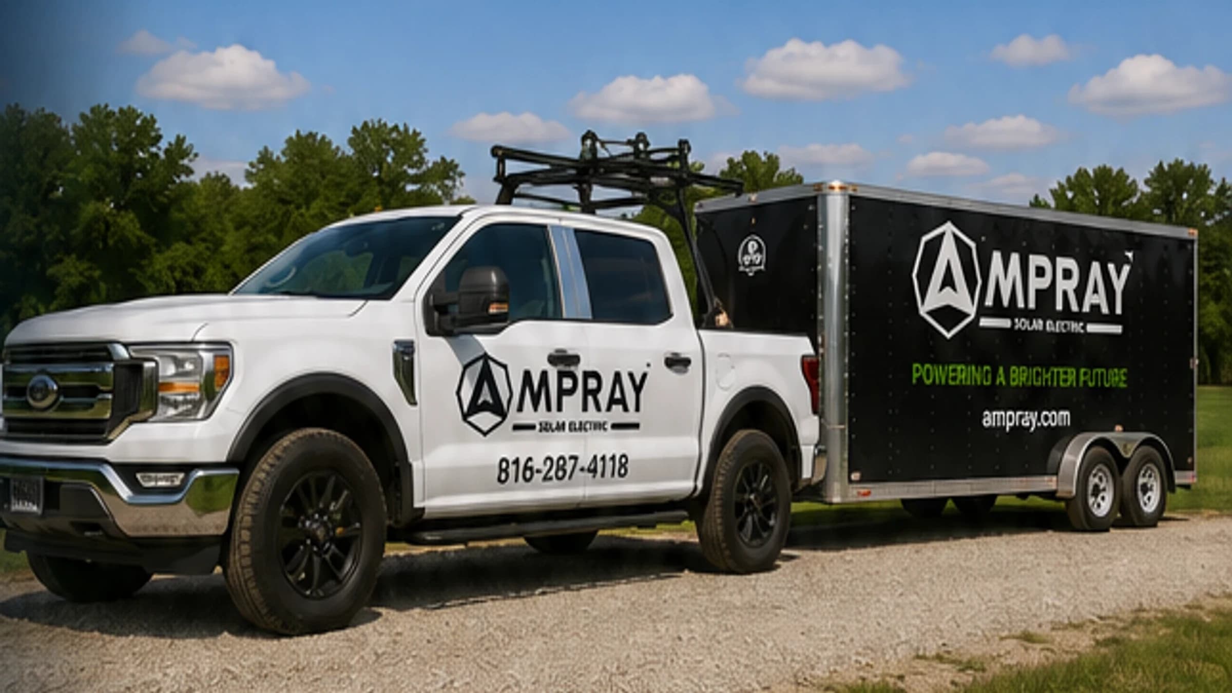 Ampray branded service truck and equipment trailer on a job site